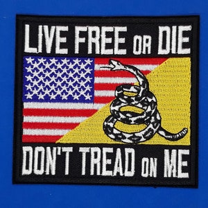 May include: Embroidered patch featuring the American flag and a coiled rattlesnake on a yellow background. The patch has the text "LIVE FREE OR DIE" and "DON'T TREAD ON ME" in white lettering on a black border.
