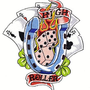 May include: Embroidered patch with a blue horseshoe, red flames, pink dice, and playing cards. The patch has a red banner with the text "HIGH ROLLER".