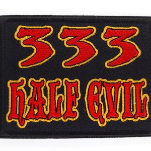 May include: Black embroidered patch with red and yellow stitching. The patch features the number "333" and the words "Half Evil".