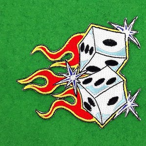 May include: Embroidered patch featuring two white dice with black dots, surrounded by red and yellow flames and blue starbursts. The patch is on a green background.