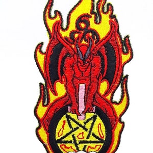 May include: An embroidered patch with a red demon figure standing on a yellow pentagram with three skulls. The demon has black wings and horns. The patch is surrounded by yellow flames and the text "HELLBOUND" is below the pentagram.