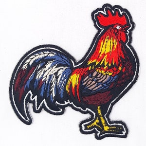 May include: Embroidered patch of a colorful rooster with a red comb and wattle, yellow and red feathers, and a blue and white tail.