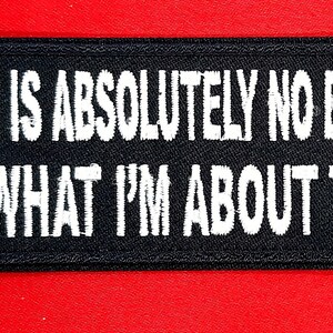 May include: Black and white embroidered patch with the text "THERE IS ABSOLUTELY NO EXCUSE FOR WHAT I'M ABOUT TO DO."