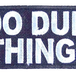 May include: Black patch with white text that reads "I DO DUMB THINGS".