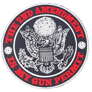 May include: A black and white embroidered patch with a red border. The patch features the Great Seal of the United States with an eagle and the text "THE 2ND AMENDMENT IS MY GUN PERMIT".