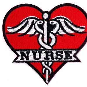 May include: Embroidered patch featuring a red heart shape with a black border. A white caduceus symbol with black accents is centered on the heart. The word "NURSE" is displayed in white block letters on a banner at the bottom.
