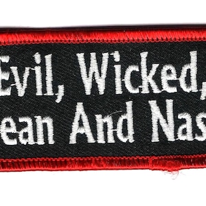 May include: Black embroidered patch with red stitching around the edges. The text on the patch reads "Evil, Wicked, Mean And Nasty".