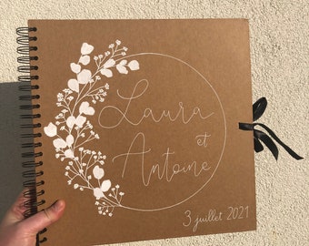 Personalized kraft guest book with first names for wedding with white details, eucalyptus and gypsophila
