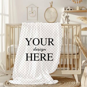 May include: A white baby blanket with the text "YOUR design HERE" printed in black.