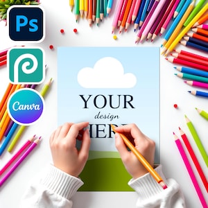 May include: A person's hands holding a yellow pencil, writing on a light blue paper with the text "YOUR design HERE". The paper has a white cloud and green landscape design. Colored pencils surround the paper.