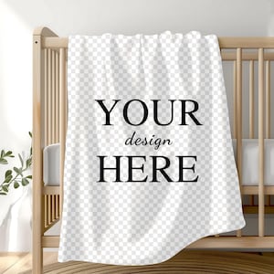 May include: White baby blanket with the text "YOUR design HERE" printed in black.