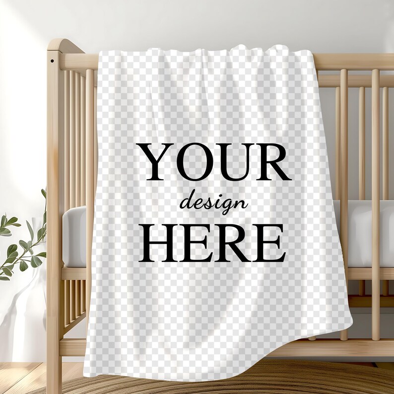 May include: White baby blanket with the text "YOUR design HERE" printed in black.