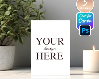 May include: A white card with the text "YOUR design HERE" in a serif font stands on a white surface. A lit candle and a potted plant are to the right and left of the card. The image also includes stickers that say "5 Mockups", "Good for Canva", and a Photoshop logo.