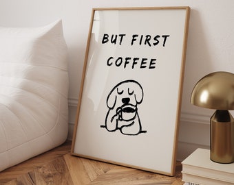 Puede incluir: Una impresión enmarcada con una ilustración en blanco y negro de un perro tomando café. El texto "BUT FIRST COFFEE" está escrito encima del perro.