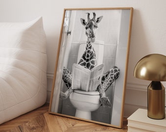 May include: A black and white photograph of a giraffe sitting on a toilet and reading a newspaper. The giraffe is wearing a serious expression. The photograph is framed in a wooden frame.