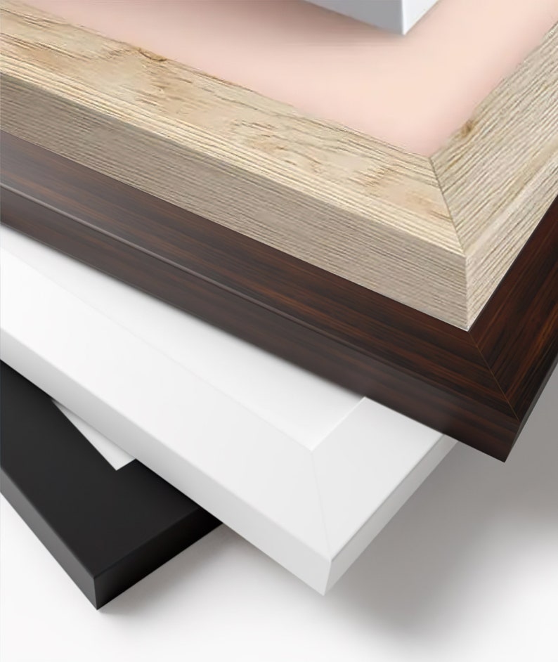 May include: A stack of picture frames in various colors and finishes. The frames include a light wood grain, dark brown wood grain, white, and black. The frames are angled, showcasing their different textures and colors.