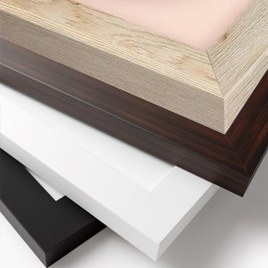 May include: A stack of picture frames in various colors and finishes. The frames include a light wood grain, dark brown wood grain, white, and black. The frames are angled, showcasing their different textures and colors.