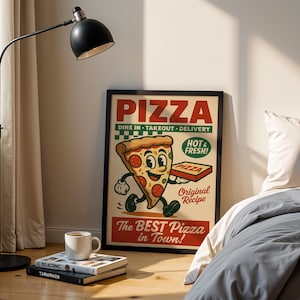 May include: A framed vintage-style pizza advertisement with a cartoon slice of pizza holding a pizza box. The poster reads "PIZZA" and "The BEST Pizza in Town!" A black floor lamp, books, and a coffee mug are in the foreground.