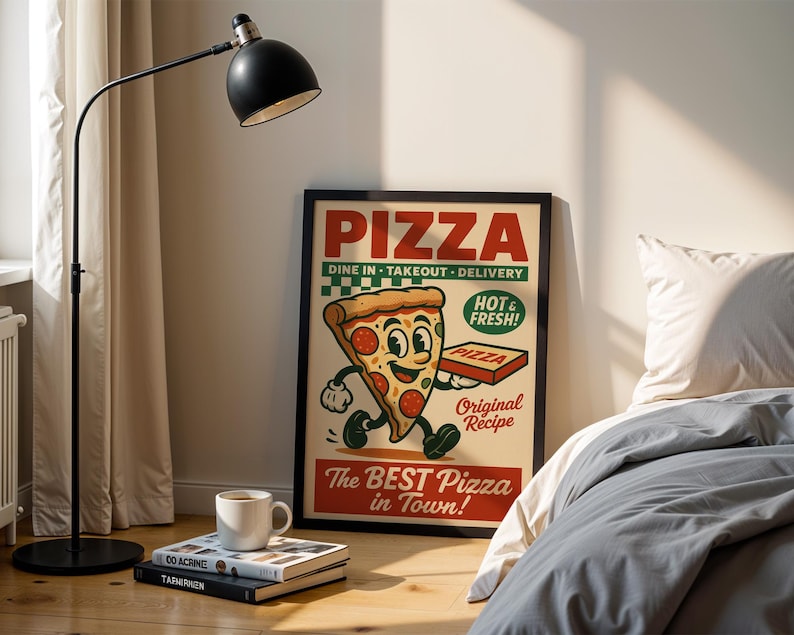 May include: A framed vintage-style pizza advertisement with a cartoon slice of pizza holding a pizza box. The poster reads "PIZZA" and "The BEST Pizza in Town!" A black floor lamp, books, and a coffee mug are in the foreground.