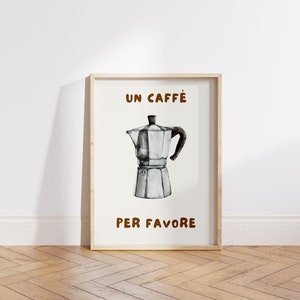 May include: A framed print with a watercolor illustration of a silver coffee pot and the text "UN CAFF&Egrave; PER FAVORE" in brown lettering.