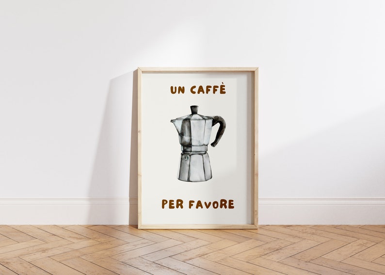 May include: A framed print with a watercolor illustration of a silver coffee pot and the text "UN CAFF&Egrave; PER FAVORE" in brown lettering.