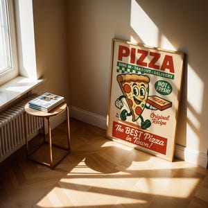 May include: A framed vintage-style pizza advertisement. The poster features a cartoon pizza slice with a smiling face, holding a pizza box. Text includes "PIZZA", "Dine In - Takeout - Delivery", "Hot & Fresh!", and "The Best Pizza in Town!"