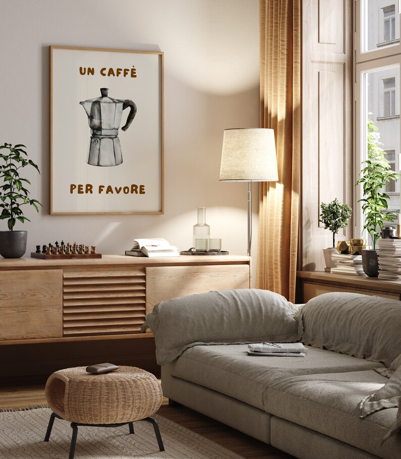 May include: A framed print with a watercolor illustration of a coffee pot and the text "Un Caffe Per Favore" in brown lettering.