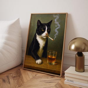 May include: Framed art print featuring a tuxedo cat with a cigarette in its mouth and a glass of amber liquid. The cat is depicted in a classic portrait style, with a green background and a wooden frame. Smoke curls upwards from the cigarette.
