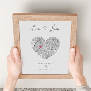 mdf wrapped oak photo frame with a black and white map of where the couples special ocassion took place (engaged or married). Their names in a swirly text at the top and underneath the photo is the special occasion date and location written