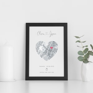 mdf wrapped black photo frame with a black and white map of where the couples special ocassion took place (engaged or married). Their names in a swirly text at the top and underneath the photo is the special occasion date and location written