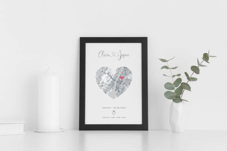 mdf wrapped black photo frame with a black and white map of where the couples special ocassion took place (engaged or married). Their names in a swirly text at the top and underneath the photo is the special occasion date and location written