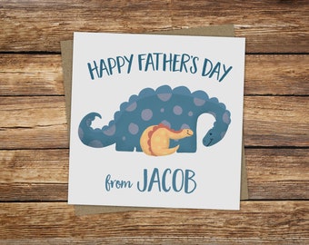 May include: A white card with a blue dinosaur and a smaller yellow dinosaur. The card says "Happy Father's Day from Jacob".