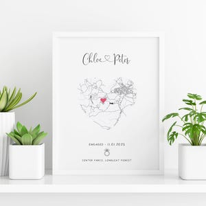 mdf wrapped white photo frame with a black and white map of where the couples special ocassion took place (engaged or married). Their names in a swirly text at the top and underneath the photo is the special occasion date and location written
