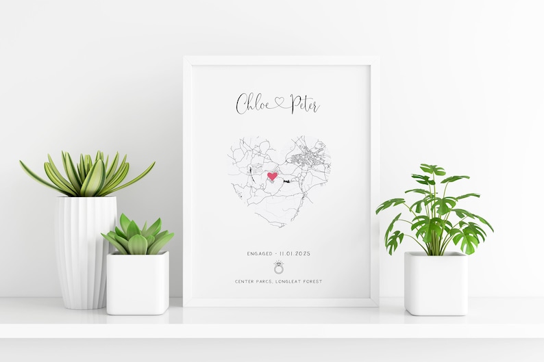mdf wrapped white photo frame with a black and white map of where the couples special ocassion took place (engaged or married). Their names in a swirly text at the top and underneath the photo is the special occasion date and location written