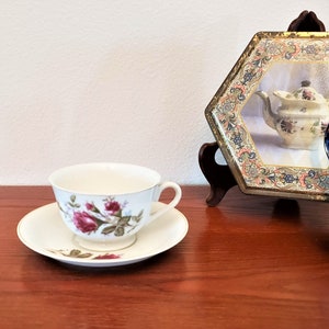 Lovely Footed Tea Cup And Saucer With Gold Trim and Handpainted Rosebuds Made in Japan