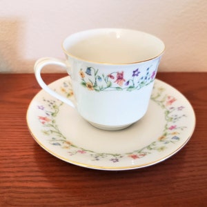 Lovely Tea Cup & Saucer With Gold Trim and Handpainted Floral Band Made in China
