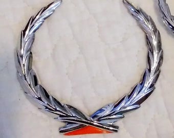 GM Trunk Lock Wreath Emblem OEM 20348828