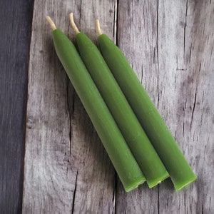 May include: Three green chime candles.