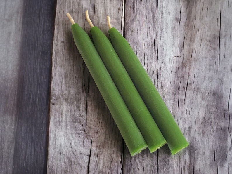 May include: Three green chime candles.