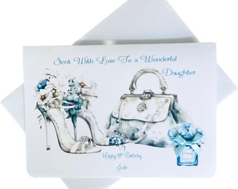 Puede incluir: Una tarjeta blanca con una ilustración azul y blanca de un par de tacones altos, un bolso de mano y una botella de perfume. La tarjeta dice "Sent with love to a wonderful daughter. Happy 18th Birthday Jodie."