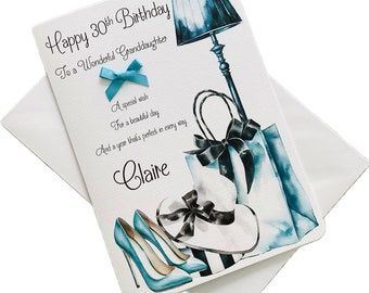 Puede incluir: Una tarjeta de cumpleaños con un diseño azul y blanco que presenta una lámpara, bolsas de compras, un sombrero y zapatos. La tarjeta dice "Happy 30th Birthday To a Wonderful Granddaughter" y "A special wish For a beautiful day And a year that's perfect in every way Claire".