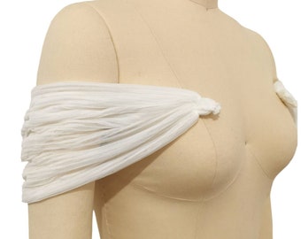 May include: White off-the-shoulder tulle fabric bridal accessory for a wedding.