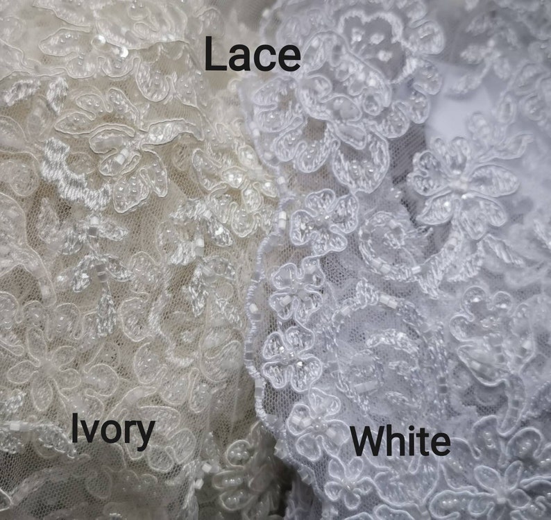 May include: Close-up of two pieces of lace fabric, one ivory and one white. The text "Lace" is written above the fabric, and the words "Ivory" and "White" are written below the fabric.