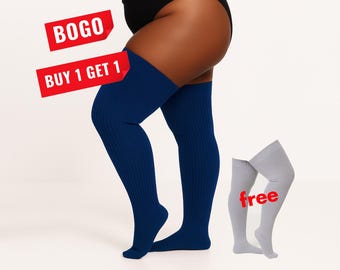 May include: A pair of dark blue ribbed thigh-high socks worn on the legs and a separate pair of light gray ribbed thigh-high socks. The image includes red text labels that read BOGO, BUY 1 GET 1, and free.