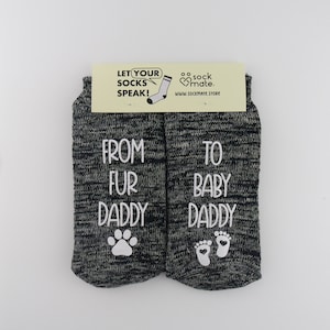 gray cotton socks for men with dog and baby symbols and 'From Fur Daddy to Baby Daddy' printed on sides