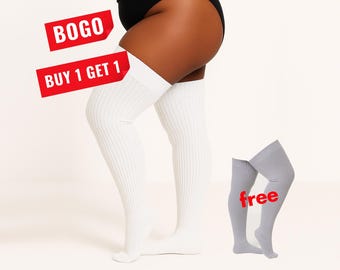 May include: White ribbed over-the-knee socks worn on legs, accompanied by a separate pair of grey ribbed over-the-knee socks. Red text overlays state BOGO, BUY 1 GET 1, and free.