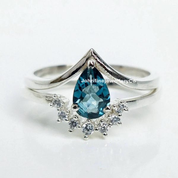 Vintage verlovingsringenset van sterling zilver met peervormige Londense blauwe topaas.