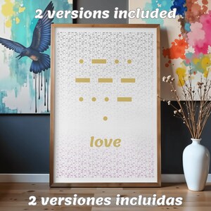 May include: A framed wall art print featuring a white background with a dense pattern of small gray dots. In the center, gold Morse code symbols are displayed above the word love in gold text. The frame is a light brown wood finish.