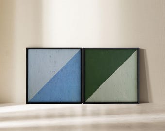 May include: Two framed abstract paintings with diagonal lines. The left painting is blue and white, and the right painting is green and white.