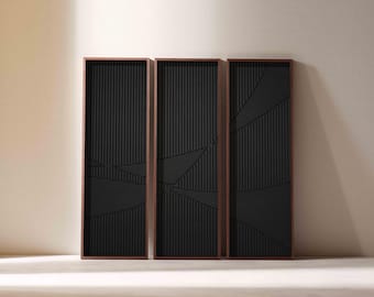 May include: Three rectangular wall panels with a dark brown frame and a black, vertically-lined interior. The black panels feature geometric designs. The panels are displayed against a neutral-colored wall.